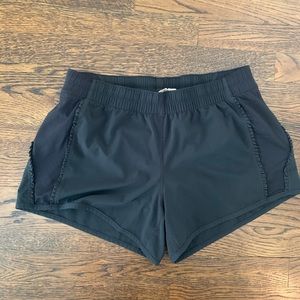 Lululemon black shorts, size 6. Pretty ruffles